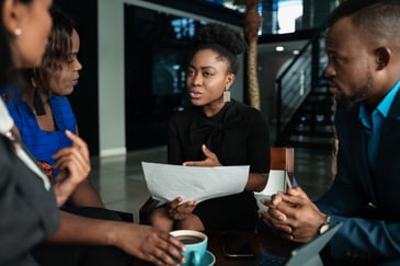 Black professionals conversing